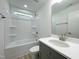 Bathroom featuring a shower-tub combination, large mirror, and a vanity sink at 112 Remington Woods Dr, Wake Forest, NC 27587