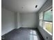 Empty bedroom with plush carpet and large window, providing ample natural light at 112 Remington Woods Dr, Wake Forest, NC 27587