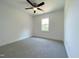 A light and airy bedroom with neutral carpet, white walls, and a ceiling fan at 112 Remington Woods Dr, Wake Forest, NC 27587