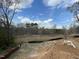 New home construction site surrounded by a lovely wooded area with beautiful sky at 112 Remington Woods Dr, Wake Forest, NC 27587