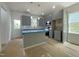 Contemporary kitchen with gray cabinets, an island, and stainless steel appliances at 112 Remington Woods Dr, Wake Forest, NC 27587