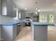 Modern kitchen with gray cabinets, stainless steel appliances, and a stylish island at 112 Remington Woods Dr, Wake Forest, NC 27587