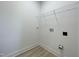 Laundry room with a white wall, white shelves, and a clean and functional design at 112 Remington Woods Dr, Wake Forest, NC 27587