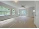Bright, spacious living room features large windows and a modern ceiling fan at 112 Remington Woods Dr, Wake Forest, NC 27587