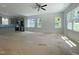 Open-concept living room and kitchen boasts abundant natural light and modern finishes at 112 Remington Woods Dr, Wake Forest, NC 27587