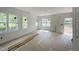 Bright living room with large windows at 112 Remington Woods Dr, Wake Forest, NC 27587
