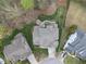 Birds-eye view of home and backyard, showing landscaping, patio, and fire pit at 113 Woodland Ridge Ct, Cary, NC 27519