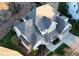 Overhead view showing architectural detailing of roof, landscaping, and neighborhood at 113 Woodland Ridge Ct, Cary, NC 27519