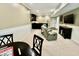 Basement with a bar, seating area, and game table creates a versatile space for recreation and relaxation at 113 Woodland Ridge Ct, Cary, NC 27519