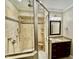 Bathroom boasts a large glass shower, updated fixtures, and stylish vanity at 113 Woodland Ridge Ct, Cary, NC 27519