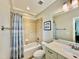 Cozy bathroom with neutral tones, a tub/shower combination, and a vanity, complemented by a framed art piece at 113 Woodland Ridge Ct, Cary, NC 27519