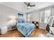 Bright bedroom with a ceiling fan, hardwood floors, and plenty of natural light at 113 Woodland Ridge Ct, Cary, NC 27519