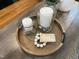 Stylish home decor featuring candles, stones, and decorative items on a wooden tray at 113 Woodland Ridge Ct, Cary, NC 27519