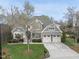 Charming two-story home with a well-manicured lawn, attached two-car garage, and a beautifully landscaped front yard at 113 Woodland Ridge Ct, Cary, NC 27519