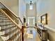Grand foyer with soaring ceilings, hardwood floors, a console table, and lots of natural light at 113 Woodland Ridge Ct, Cary, NC 27519