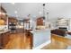 Spacious kitchen with two islands, stainless steel appliances, custom cabinets, and hardwood floors at 113 Woodland Ridge Ct, Cary, NC 27519