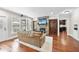 Comfortable living room boasts a stone fireplace, hardwood floors, and an open layout with backyard view at 113 Woodland Ridge Ct, Cary, NC 27519