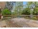 The back deck overlooks a beautiful, well-manicured backyard at 1205 Country Ridge Dr, Raleigh, NC 27609