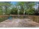 Deck overlooking the private yard with mature trees at 1205 Country Ridge Dr, Raleigh, NC 27609