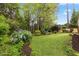 A sprawling backyard with lush greenery and vibrant landscape at 1205 Country Ridge Dr, Raleigh, NC 27609