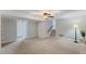 View of the finished basement featuring gray walls, plush carpeting, and a ceiling fan with lighting at 1205 Country Ridge Dr, Raleigh, NC 27609