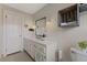 Bright bathroom features a sink with a large mirror and cabinet space at 1205 Country Ridge Dr, Raleigh, NC 27609