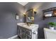 Bathroom with gray walls, single sink vanity, a window, and a toilet at 1205 Country Ridge Dr, Raleigh, NC 27609