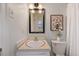 Bathroom featuring a clean vanity and updated lighting fixture at 1205 Country Ridge Dr, Raleigh, NC 27609