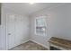 Bedroom featuring neutral walls, flooring, large windows for natural light, and ample closet space at 1205 Country Ridge Dr, Raleigh, NC 27609