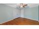Spacious bedroom with ceiling fan, closet, and hardwood floors at 1205 Country Ridge Dr, Raleigh, NC 27609