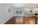 Bright dining area with hardwood floors and modern lighting fixtures at 1205 Country Ridge Dr, Raleigh, NC 27609