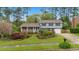 Charming two-story home featuring well-maintained landscaping and a welcoming front porch at 1205 Country Ridge Dr, Raleigh, NC 27609