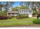 Charming two-story home featuring well-maintained landscaping and a welcoming front porch at 1205 Country Ridge Dr, Raleigh, NC 27609