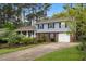 Charming two-story home featuring well-maintained landscaping and a welcoming front porch at 1205 Country Ridge Dr, Raleigh, NC 27609