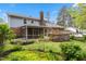 Rear exterior view of home with screened porch, deck and garden at 1205 Country Ridge Dr, Raleigh, NC 27609