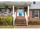 Inviting front entrance featuring a bright blue door and brick steps at 1205 Country Ridge Dr, Raleigh, NC 27609