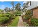 Lush front yard with walkway leading to a welcoming porch and front door at 1205 Country Ridge Dr, Raleigh, NC 27609