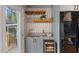 Convenient kitchen bar area includes a wine cooler, sink, and storage at 1205 Country Ridge Dr, Raleigh, NC 27609