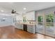 Bright eat-in kitchen with stainless steel appliances, backyard deck access, and ample counter space at 1205 Country Ridge Dr, Raleigh, NC 27609