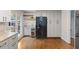 Modern kitchen boasts stainless steel appliances, ample cabinet space, and hardwood floors at 1205 Country Ridge Dr, Raleigh, NC 27609