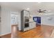 Open-concept kitchen features stainless steel appliances and seamless transition to dining and living areas at 1205 Country Ridge Dr, Raleigh, NC 27609
