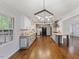 Modern kitchen with stainless steel appliances, hardwood floors, and open layout at 1205 Country Ridge Dr, Raleigh, NC 27609