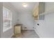 Spacious laundry room with cabinets and desk space, offering convenience at 1205 Country Ridge Dr, Raleigh, NC 27609