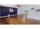 Spacious living room featuring hardwood floors, modern lighting, and stylish decor at 1205 Country Ridge Dr, Raleigh, NC 27609