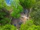 Aerial shot of the community playground, nestled in lush greenery, promoting a fun and active lifestyle at 1205 Country Ridge Dr, Raleigh, NC 27609