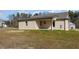Backyard featuring a covered porch and ample space for outdoor activities at 122 Wilderness Trl, Smithfield, NC 27577