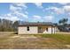 Backyard featuring a covered porch and ample space for outdoor activities at 122 Wilderness Trl, Smithfield, NC 27577