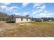Backyard featuring a covered porch and ample space for outdoor activities at 122 Wilderness Trl, Smithfield, NC 27577
