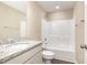 Bathroom showcasing a granite countertop vanity, a toilet, and a shower with a bathtub at 122 Wilderness Trl, Smithfield, NC 27577