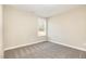 This bedroom includes carpeted floors and a window with natural light at 122 Wilderness Trl, Smithfield, NC 27577